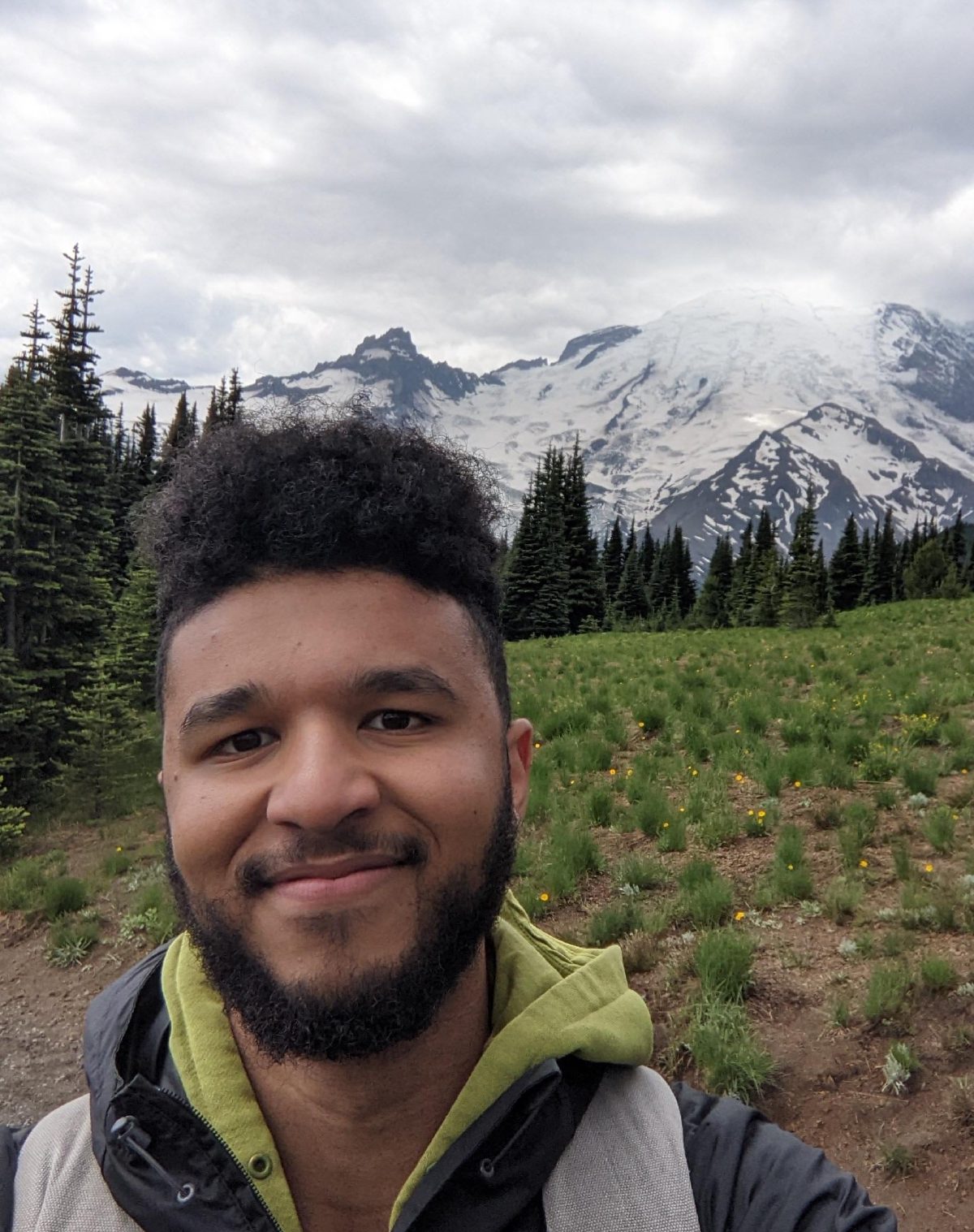 Andalib Samandari in a meadow below Mount Rainier